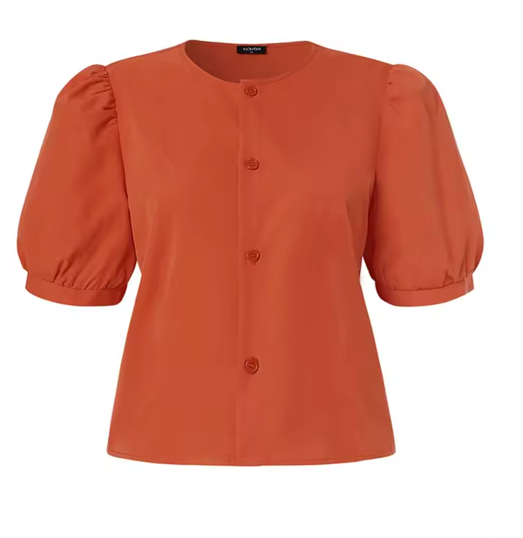 Orange short sleeve blouse against light background