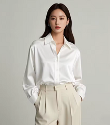 Woman wearing white blouse agains light background